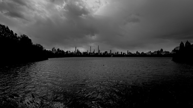 Storm light over the Central Park reservoir, the skyline in silhouette
